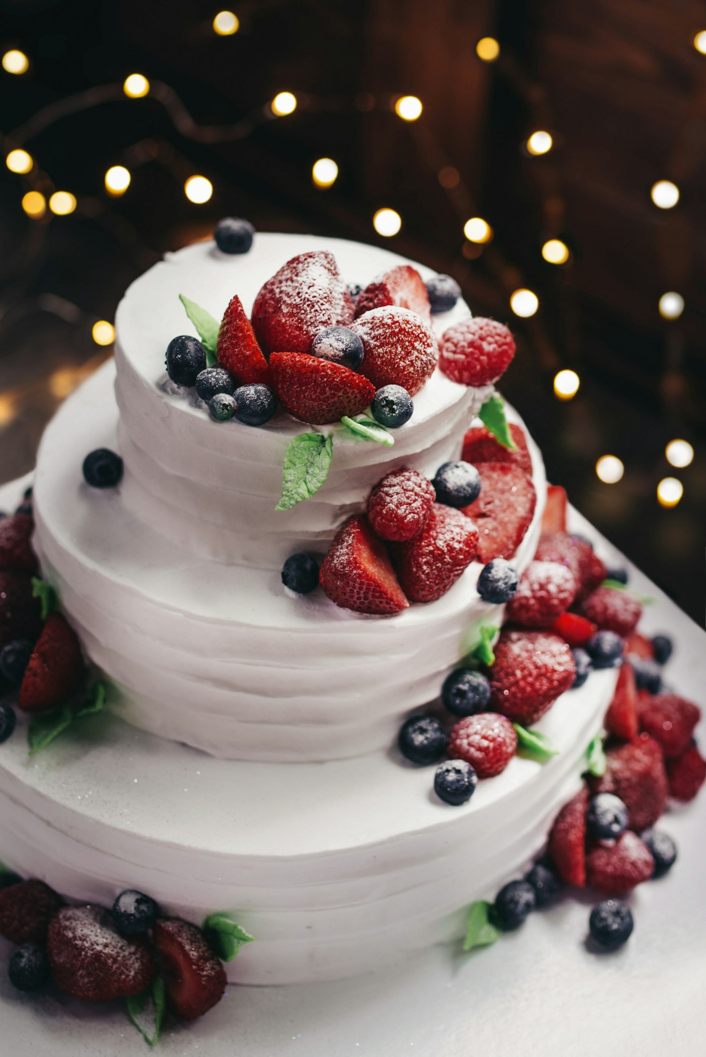 White cake topped with fresh berries