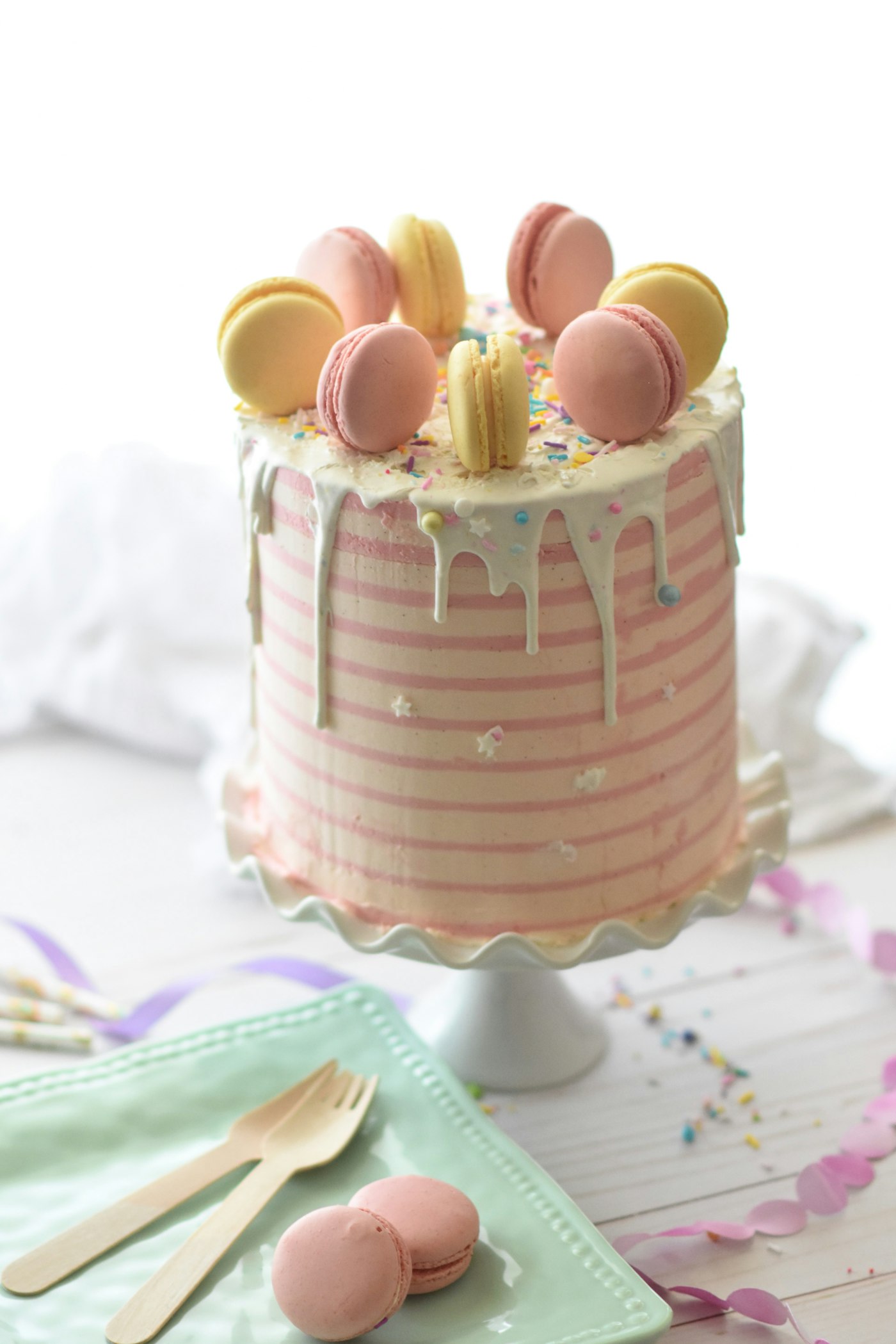 Pastel cake decorated with macarons